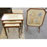 A mahogany fire screen table, the panel embroidered behind glass together with a nest of tables with