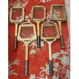 Five wood framed tennis rackets, with clamps, other wooden rackets and a collection of golf clubs