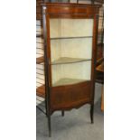 An Edwardian mahogany corner display cabinet with boxwood inlay, serpentine glass door, lined