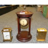 A Swiss carriage clock together with a French one and a clock mounted in a wooden 'Folly' (3).