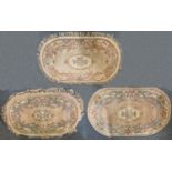 3 Chinese wool oval rugs ranging from 130 cm to 150 cm long (3).