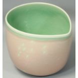 Caroline Whyman, a crackle glazed pouring jug in light pink glaze, celadon interior and rim,