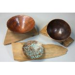 Roger Barnes, three graduated patinated and hammered copper bowls, together with three wooden stands