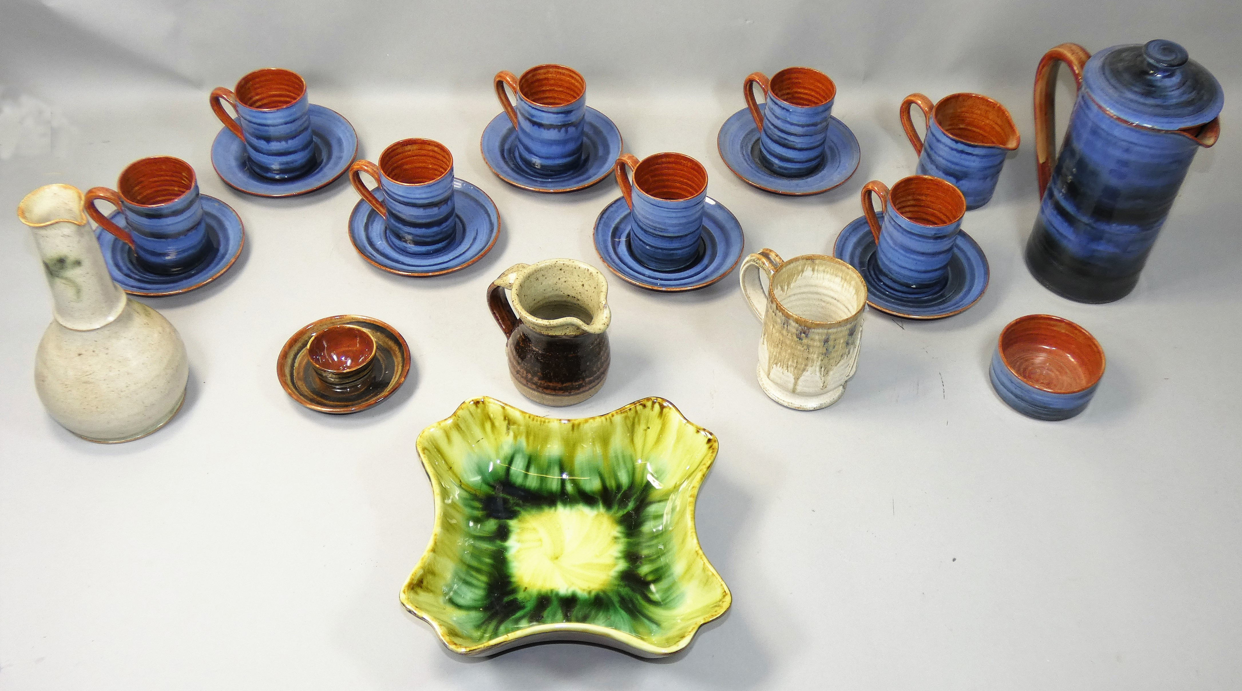 A collection of Wold handthrown commemorative pottery, to include six coffee cups and saucers,