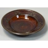 Peter Dick (1936 - 2012), a small glazed dish, impressed mark to the base, diameter 15.