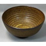 Mick Arnup, a stoneware bowl with spiral design, signature to base, diameter 21cm.