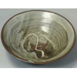 David Leach OBE (1911 - 2005), a porcelain dish, rich tenmoku glaze with thick crawling white