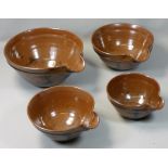 David Lloyd-Jones (1928 - 1994), a set of four stoneware graduated pouring bowls, each with embossed