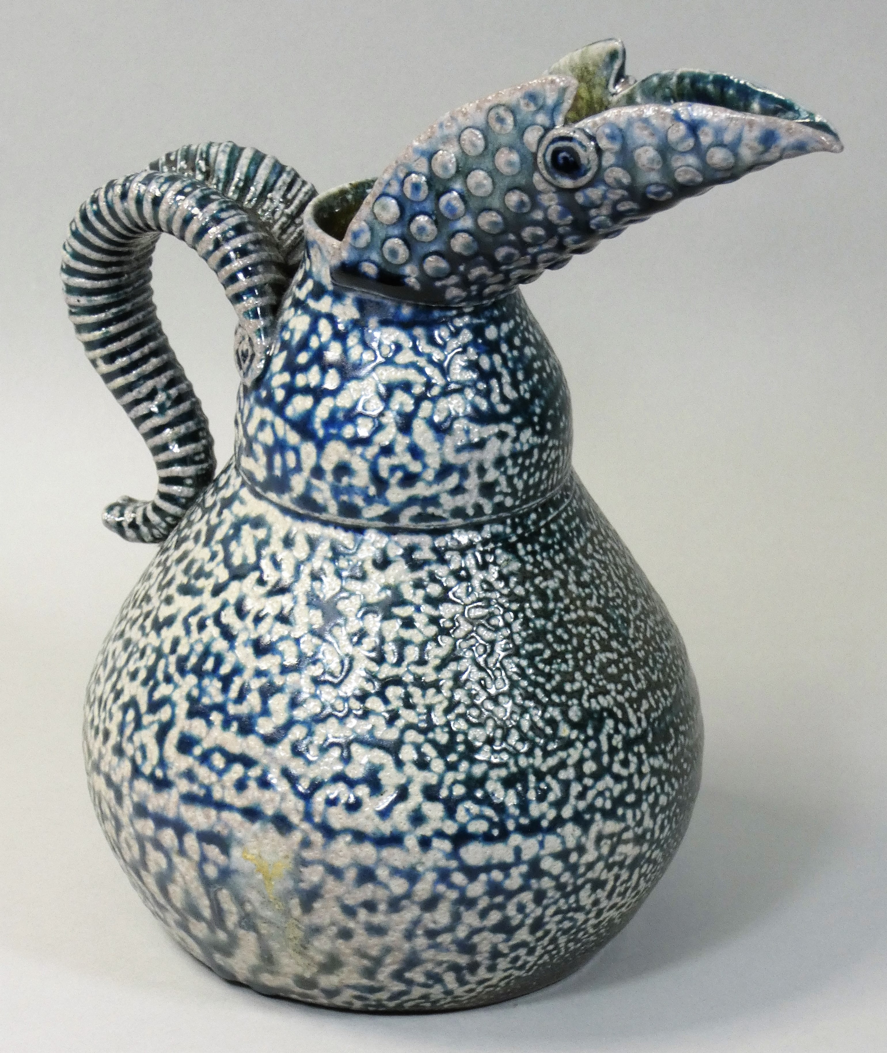 Mark Smith (c.2000), a blue salt glaze jug with long spout, impressed mark, height 22cm.