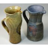 A pair of stoneware pottery jugs, cobalt blue with scroll handle, by Nigel Gow for Blackadder