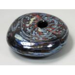 Peter Layton (b.1937), a black and iridescent free blown pebble form, with etched makers name,