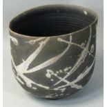 Tim Andrews (b.1960), a stoneware Raku fired bowl of ovoid form, crackle glazed abstract pattern,