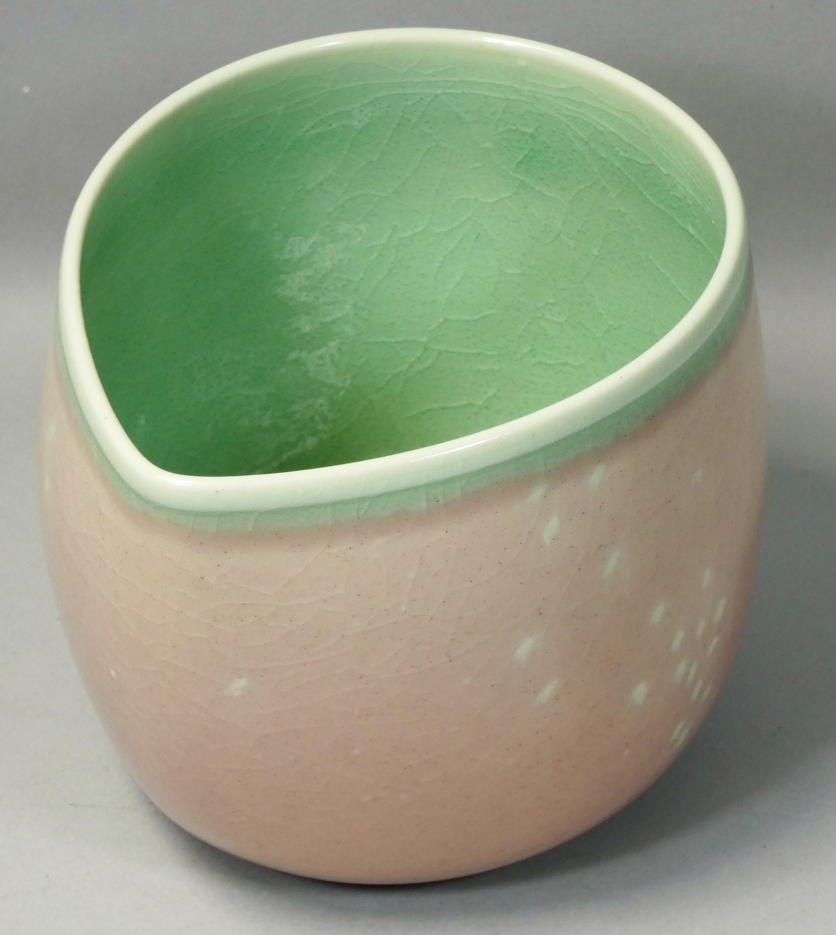 Caroline Whyman, a crackle glazed pouring jug in light pink glaze, celadon interior and rim, - Image 2 of 4