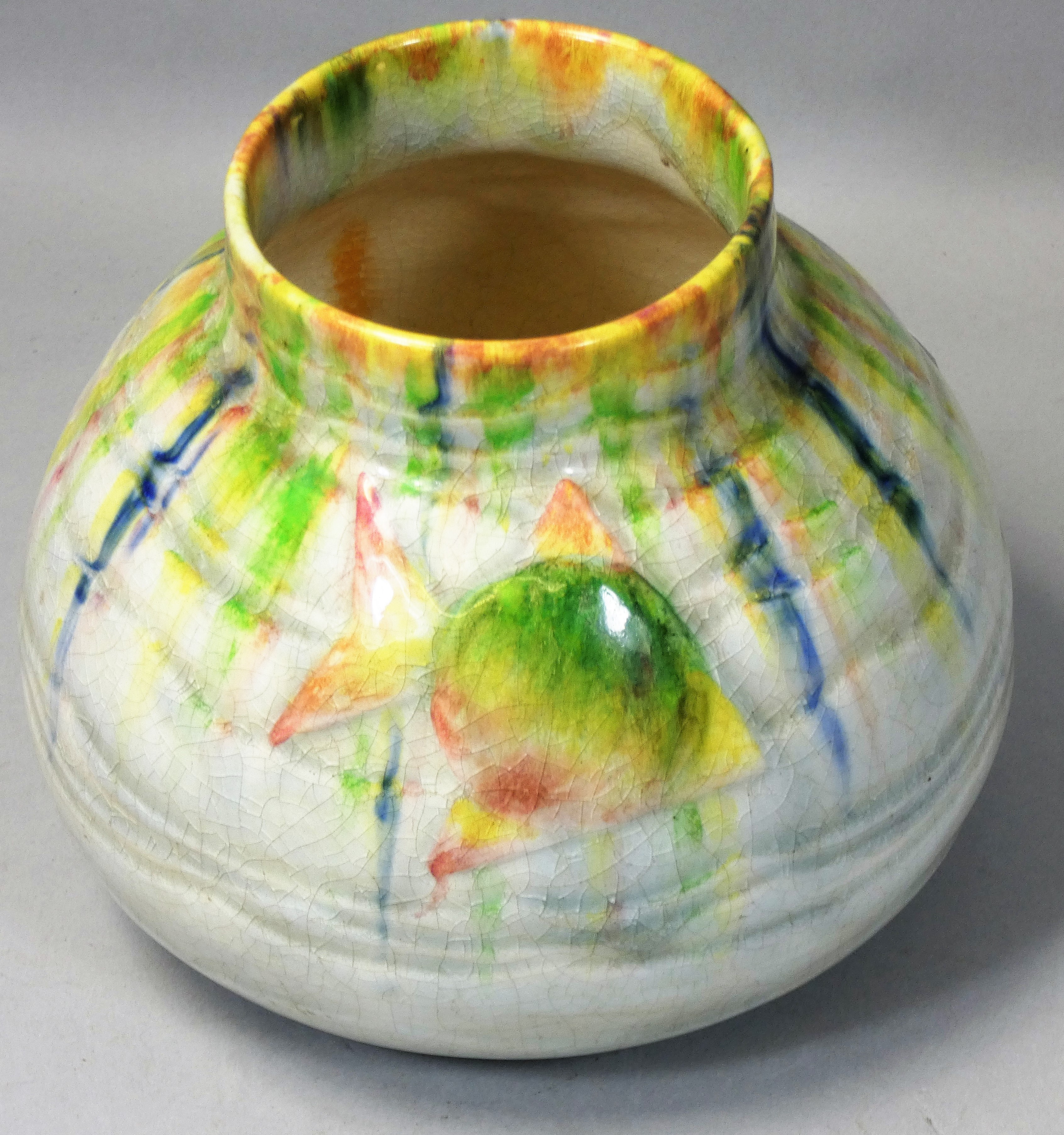 A Bretty crackle glazed vase with fish decoration, multicoloured drip glaze on a cream ground,