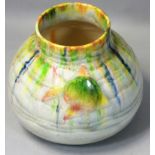 A Bretty crackle glazed vase with fish decoration, multicoloured drip glaze on a cream ground,