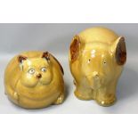 A studio pottery glazed model of a comical cross-eyed overweight cat, height 12cm, together with