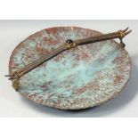 Roger Barnes, a patinated and hammered copper dish, with carry handle, diameter 22.5cm.