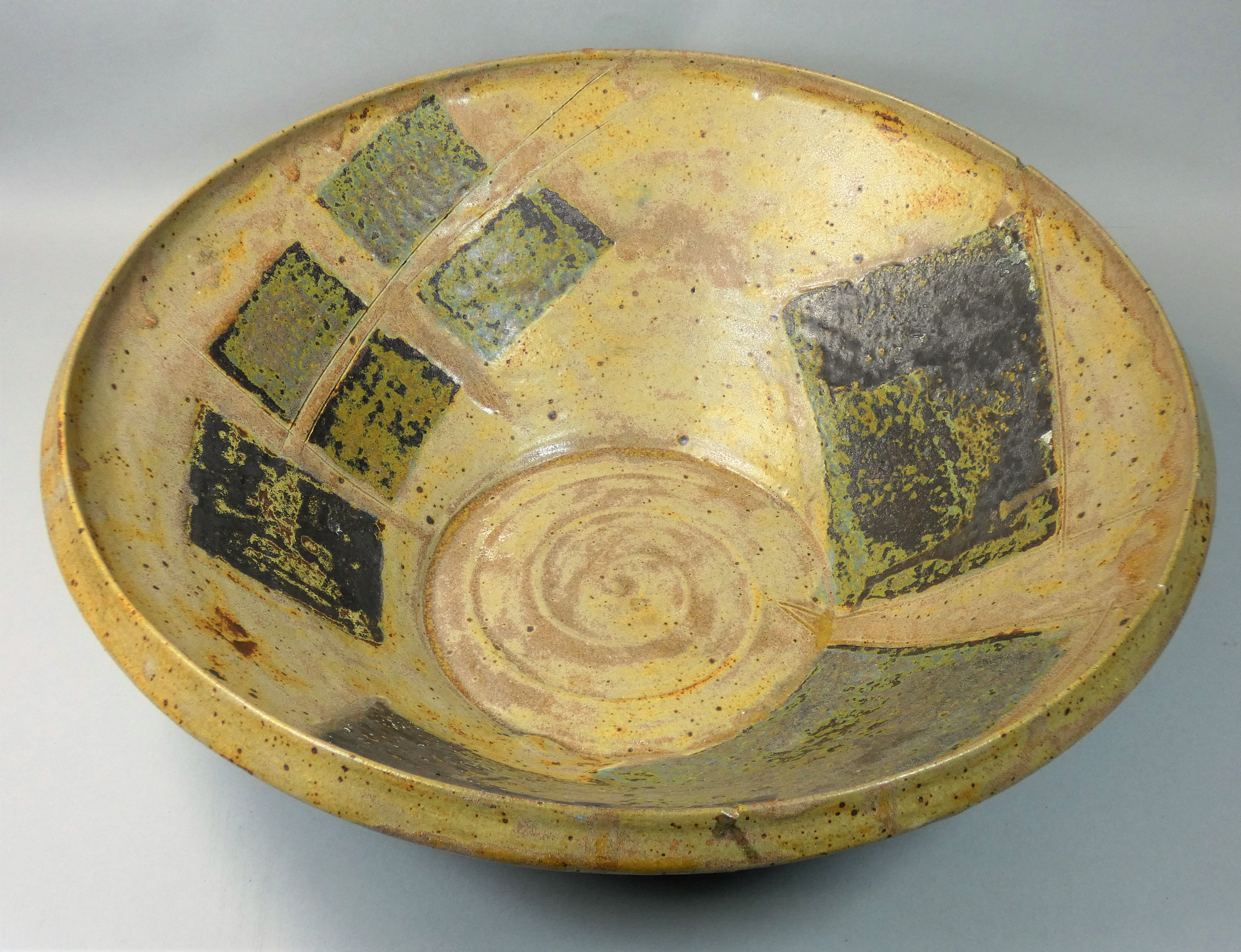 Charles Bound (b.1939), a large stoneware dish with abstract geometric pattern, purchased from the