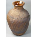 Siddig El Nigoumi (1931 - 1996), an earthenware vase, with incised linear decoration, glazed