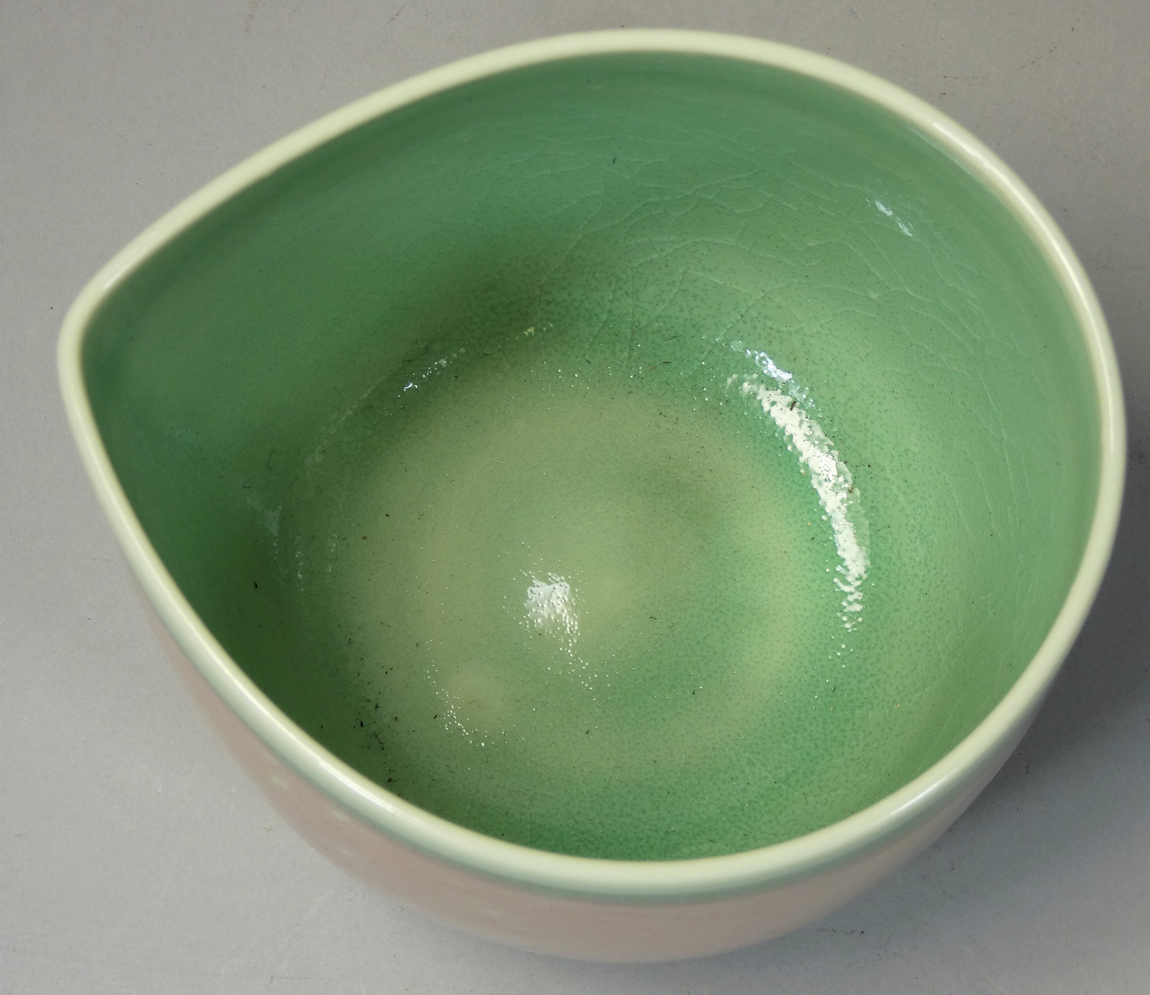 Caroline Whyman, a crackle glazed pouring jug in light pink glaze, celadon interior and rim, - Image 3 of 4