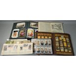 A collection of cigarette cards, together with a postcard album including early photographs, many