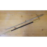 A dress sword, with brass hilt and etched blade, blade painted and brass scabbard, blade 71 cm.