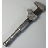 A N.E.R. adjustable workshop wrench stamped N.E.R. 31 cm long.