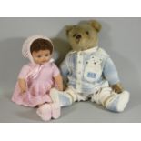 An early stuffed teddy bear, together with a composite doll with closing eyes wearing a pink