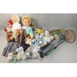 Four boxes of assorted dolls and teddy bears, together with early badminton/tennis rackets and