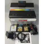 A boxed Atari 7800 video game system, with power supply unit, two mini-stick controllers and