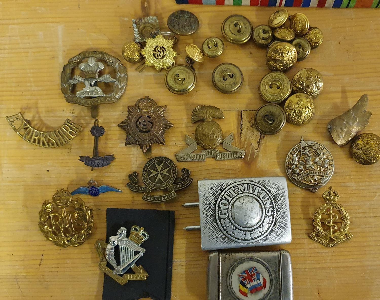 A German Gott Mit Uns belt buckle, worn, various cap badges and buttons.