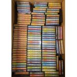 Approximately one hundred C64 magazine cover cassette tape games in small cases, with full games and
