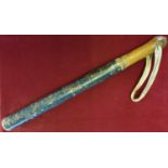 A painted wooden truncheon, decorated with a GR III insignia and dated 1795, length 48 cm.