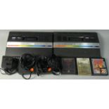 Two Atari 2600 JR games consoles, together with two controllers, television lead, Tadmod power