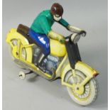 An early tinplate wind-up model of a motorcycle, lithographed green dressed rider and yellow