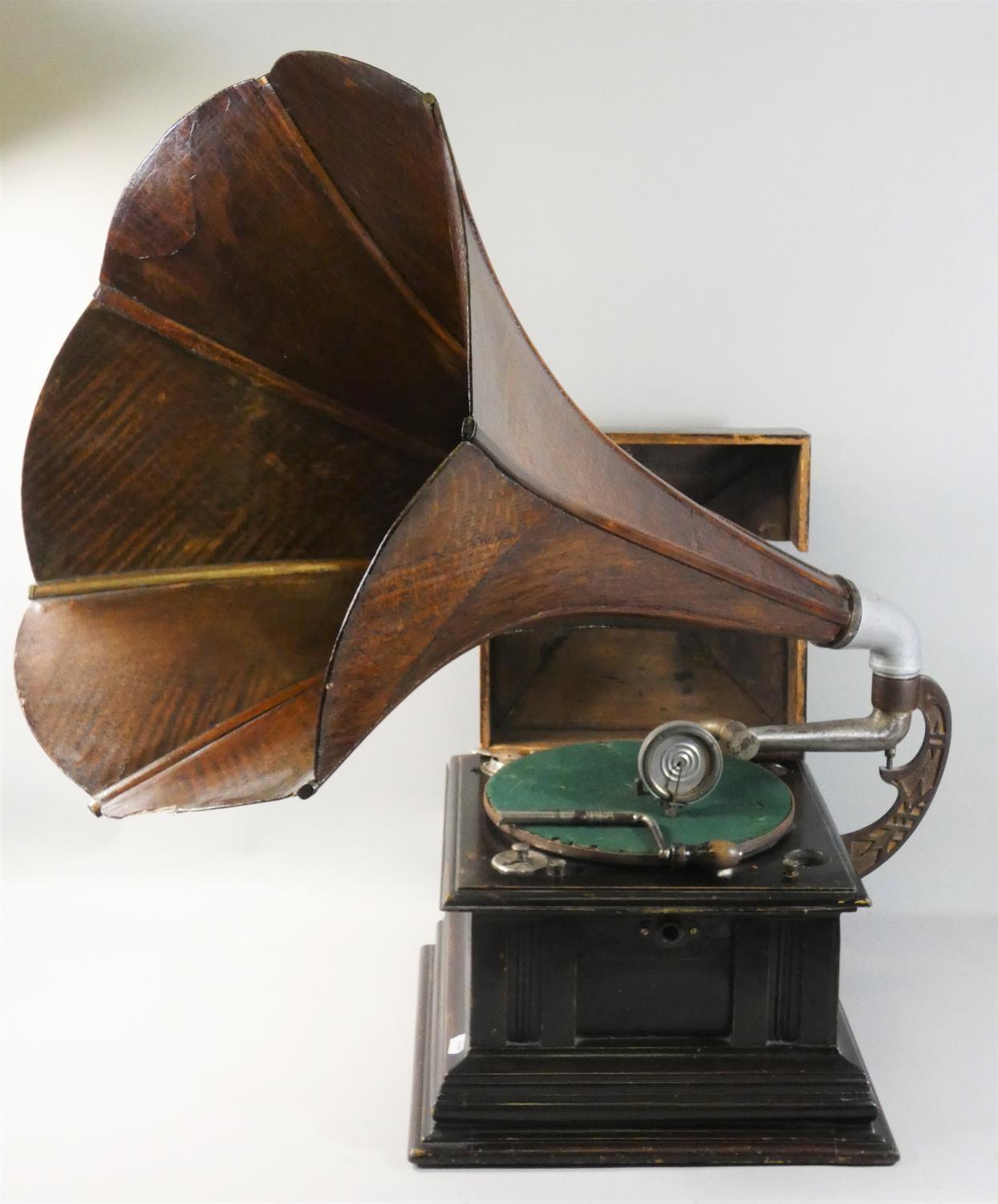 An Edwardian wind up gramophone, with ebonised case and oak horn, winding key.