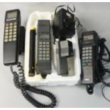 An early Mobira ?portable? telephone housed in original polystyrene packaging, with phone stand,