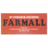 A painted metal sign 'McCormick-Deering Farmall', made by International Harvester Company Chicago