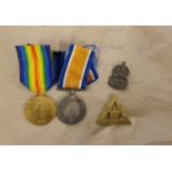 A pair WWI medals awarded to DVR Mead R.E., Victory and War, a On War Service, brass badge, a silver