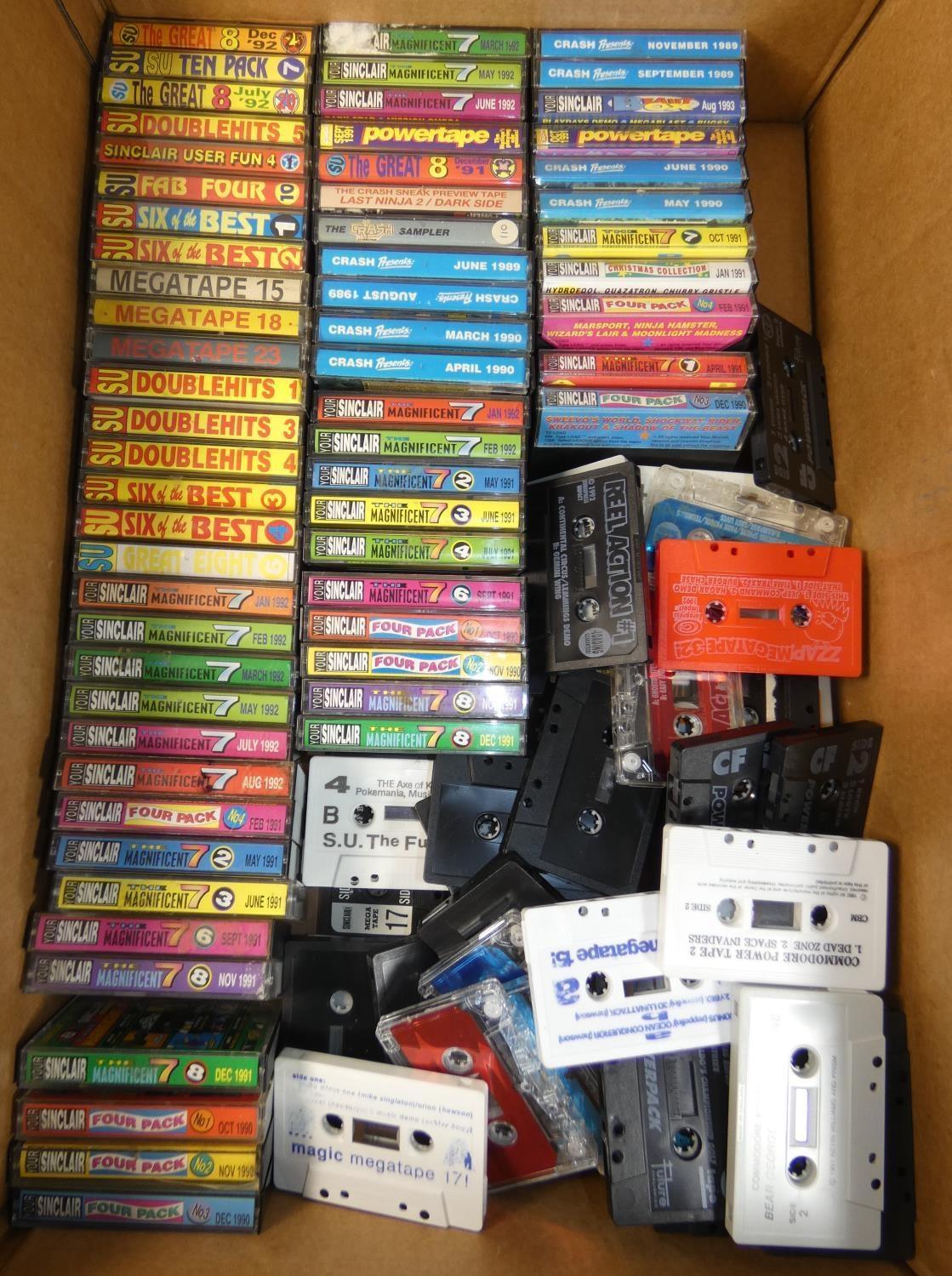 Approximately eighty ZX Spectrum magazine cover cassette tape games in small cases, with full