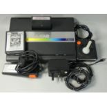 An Atari 7800 video games console, together with power supply unit, 2 x 7800 cart games; Choplifter!