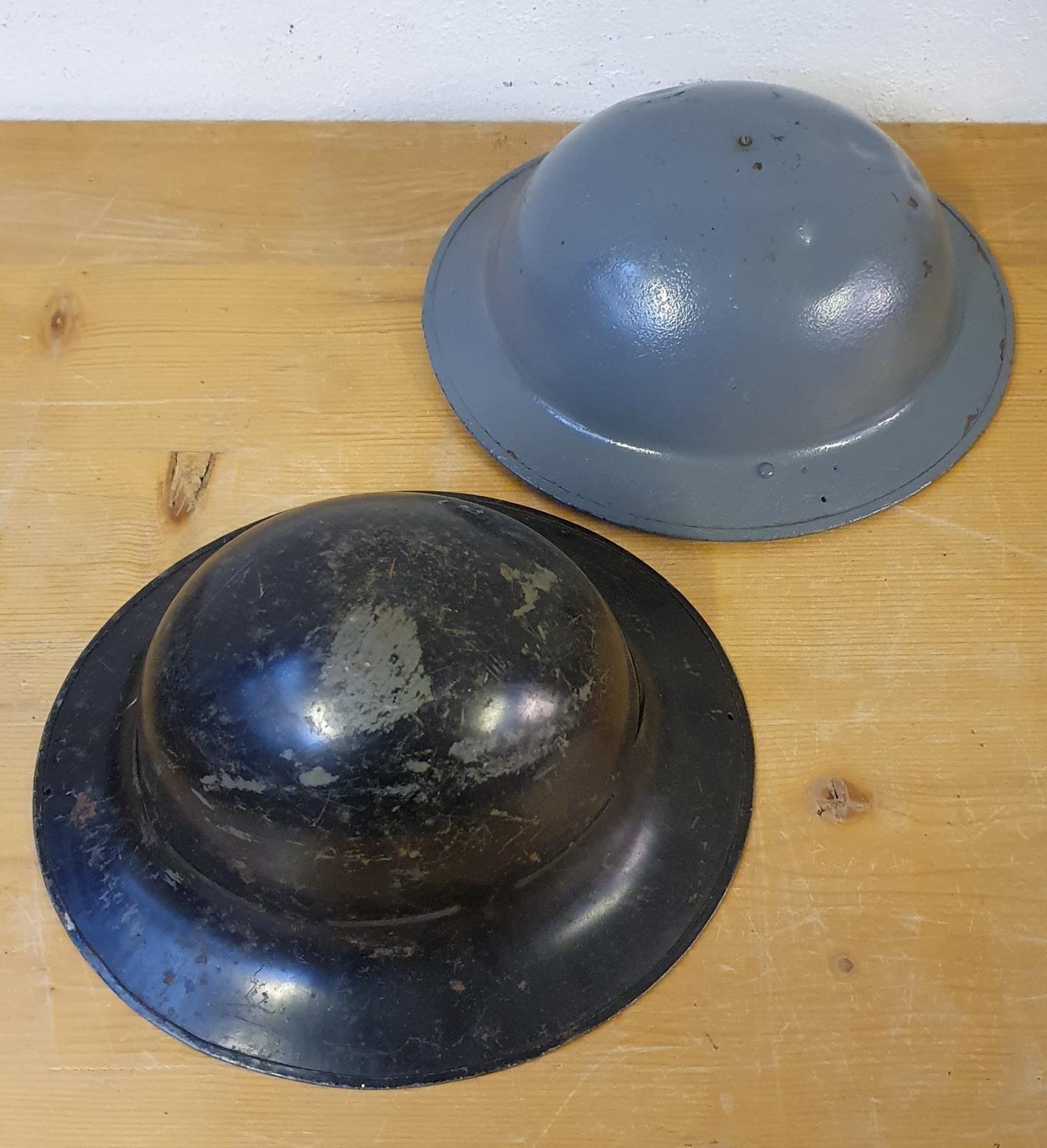 A Belgium WWII metal helmet, stamped BMB and another WWII helmet dated 1941 (2).