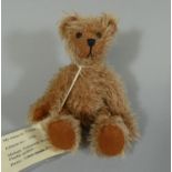 A miniature handmade bear 'Chili', by Woodgate Bears, No. 1055, with mohair, height 16cm.