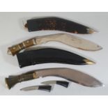 An Indian Kukri, with horn hilt and prick dot decoration, together with another Kukri with