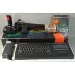 A boxed Sinclair ZX Spectrum +2A in black, with power supply unit, manual and television lead,