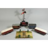 A collection of assorted pre-war coaches, tracks and locomotives, to include a tin plate railway