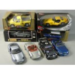 A collection of boxed and unboxed die-cast model vehicles by Maisto, Bburago and others, to