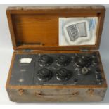 An oak cased wheatstone bridge with galvanometer, by Elliott Brothers (London) Ltd, No. 623063, with