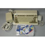 A Commodore Amiga A600, together with power supply unit, Commodore mouse, Smiga Workbench V2.05,