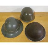 A English WWII type helmet, an USA helmet and another helmet, no markings (3).